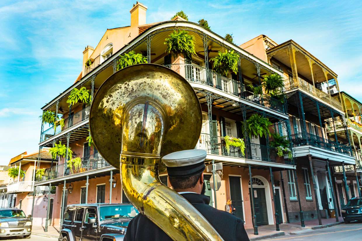 Street Corner in New Orleans with Man standing with Instrument