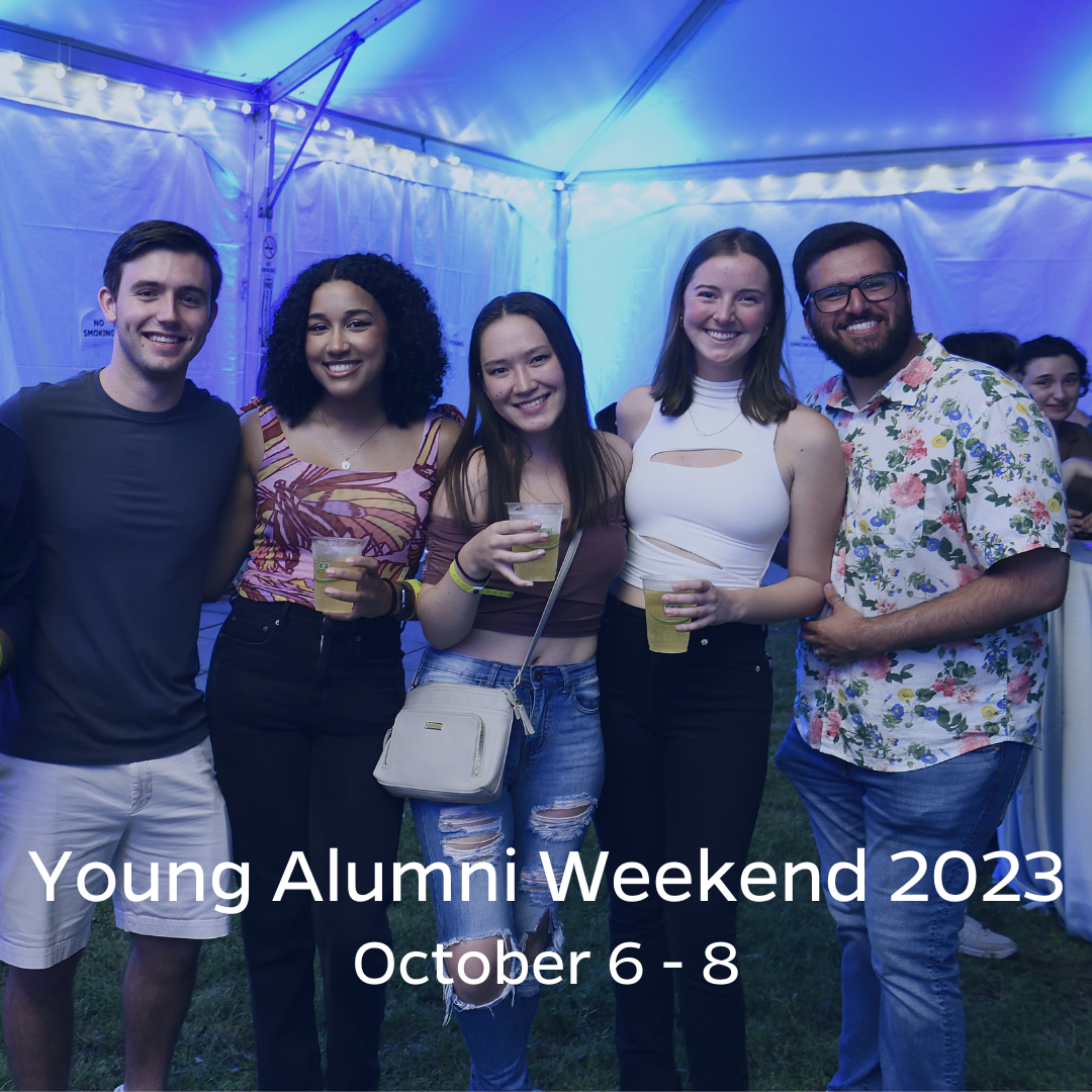 Young alumni enjoying tent party celebrations on the Homewood campus in Baltimore, MD