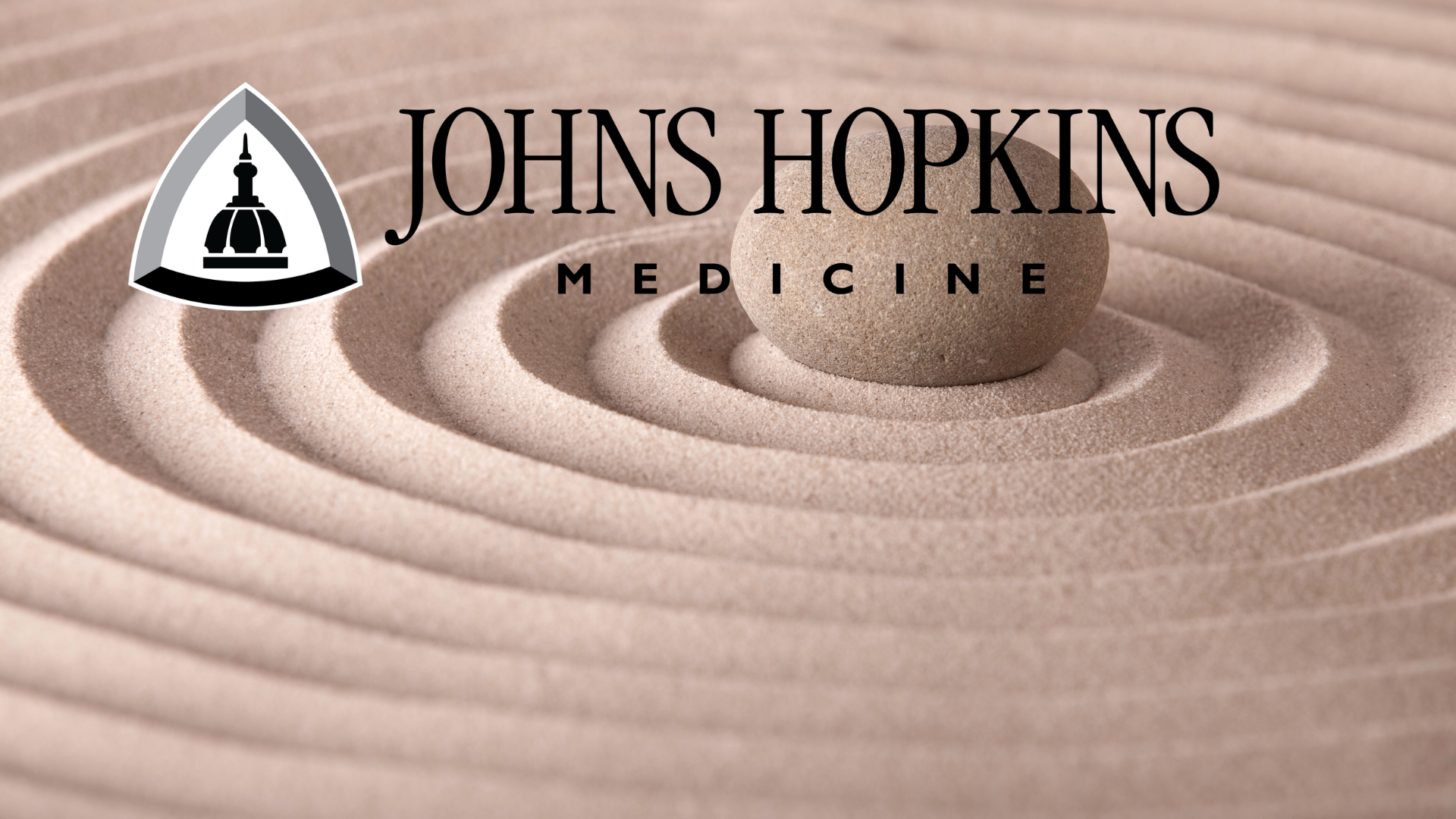 Sand in circles with the Johns Hopkins Medicine Logo on top