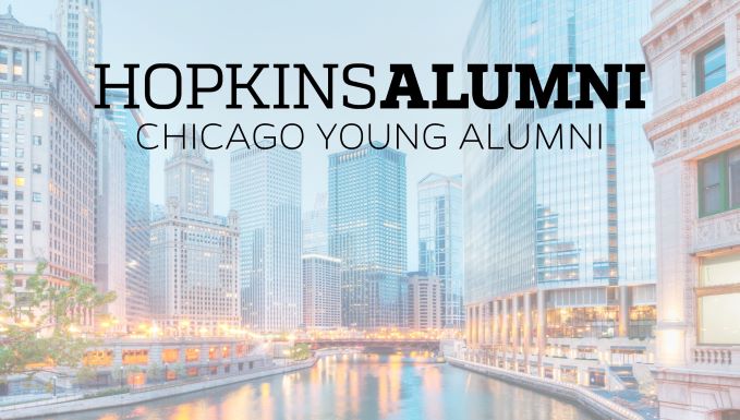 Hopkins Chicago Young Alumni with the riverfront skyline